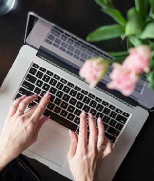 woman typing on laptop